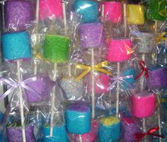 there are many different colored lollipops wrapped in plastic