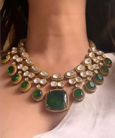 Introducing our exquisite Gold Finish Emerald Green Doublet Stones  Kundan Wedding Jewelry Necklace Set, inspired by the timeless elegance of Sabyasachi jewelry. Necklace length:15-16"  Adjustable length with a golden zari dori at the back  Necklace width-11" Pendant length and width 1"  This stunning set features meticulously crafted emerald green doublet stones, uncut moissanite, and intricate polki kundan work, all set in a luxurious gold finish. Perfect for a bride or anyone looking to make Engagement Lengha, Wedding Jewelry Necklace, Sabyasachi Jewelry, Unique Wedding Jewelry, Kundan Work, Artificial Jewelry, Gold Backdrop, Sabyasachi Jewellery, Polki Necklace