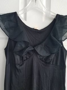 This is a vintage, Gilead night gown. It is sleeveless and has a ruffled portion. It is nylon, made in the usa and floor length. There are some flaws in the material as you can see in the images. The price reflects this. All sales are final. The measurements are as follows: (measurements taken flat and unstretched) Nightgown: Armpit to Armpit: 18 inches Waist: 17.5 inches Hips: 26 inches Length from top of shoulder to middle of hem: 52.5 inches This is a very elegant piece. It is timeless and cl Fitted Ruffle Camisole Dress, Fitted Camisole Dress With Ruffles, Spring Evening V-neck Nightgown, Sleeveless Dress For Night Occasion, Summer Satin Evening Nightgown, Summer Evening Satin Nightgown, Vintage Fitted Ruffle Nightgown, Vintage Fitted Nightgown With Ruffles, Fitted Vintage Nightgown With Ruffles