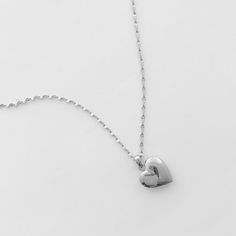 A romantic and timeless locket in a modern, dainty silhouette. The functional heart locket hangs upon a delicately twisted chain. Versatile enough to simply be worn solo or layered as the perfect compliment to your favorite necklaces. Adjustable between 18-21". Locket measures 1/2". Our materials make for an amazing, high quality, seamless, jewelry piece with longevity. Our necklaces are plated with 18k gold, 18k rose gold, or rhodium and finished with a protective coating. A little secret we’ll Golden Heart Locket, Twisted Chain, Golden Heart, Silver Lockets, Bottle Bag, Simply Be, Heart Locket, Mens Skin Care, Silver Roses