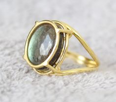 Custom Labradorite Moonstone Opal Tsavorite Amethyst Peridot Ring We have thousand of Designs- Please choose any gemstone and Design and we will have the Estimate for you within 1-2 days. Feel free to call text whats app on US Mob +1-714-924-2732 Inv#117#7 S22 Yellow Gold Labradorite Round Jewelry, Gold Round Gemstones With Large Stone, Green Gemstone Jewelry With Labradorite, Artisan Emerald Ring With Round Gemstone, Artisan Emerald Ring, Large Round Labradorite Gemstones, Artisan Round Moonstone Ring, Unique Oval Moonstone Ring With Bezel Setting, May Birthstone Emerald Ring With Natural Stones