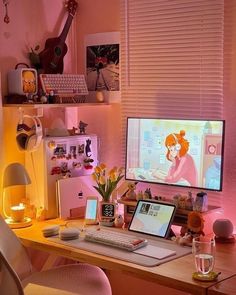 a desktop computer sitting on top of a wooden desk next to a lamp and chair