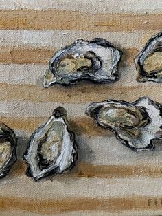 some oysters are sitting on a cutting board