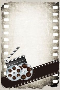 an old film strip with some movie reels and a clapper on it's side