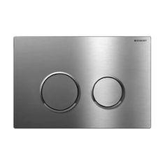 a stainless steel wall plate with two round knobs on the front and one circle in the middle