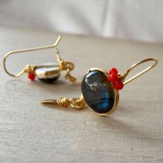 Labradorite Earrings, Labradorite Coral Crown Earrings, Gemstone Earrings, Gold Filled Jewelry, Anniversary Gift, Bohemian Jewelry These labradorite earrings are delicate, minimalist and bold. Unique settings of genuine labradorite gemstone and beautiful coral crown on top. A shiny handmade gold filled leaf dangles gently. Each leaf is hand crafted by me, and has its own unique shape. These earrings would be a beautiful gift for your special one or yourself. The hook is made of gold filled. The Wire Wrapped Fusion Earrings For Gift, Fusion Style Wire Wrapped Earrings For Gift, Labradorite Wire Wrapped Earrings As A Gift, Labrodite Earrings, Gold Labradorite Earrings, Elegant Handmade Labradorite Earrings, Handmade Artisan Labradorite Earrings, Gold Wire Wrapped Labradorite Earrings, Bohemian Labradorite Earrings With Natural Stones