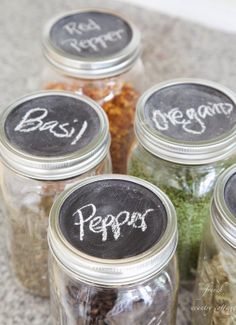 six jars filled with different types of spices