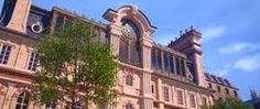 a large building with many windows and trees