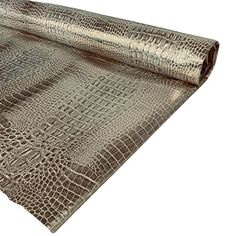 a roll of metallic foil with an alligator skin pattern