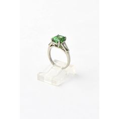 Stunning GIA certed natural Tsavorite Garnet mounted in a simple tapered baguette diamond and platinum mounting.  The 2.78 carat tsavorite  2.78 is an gorgeous green transparent color.    US size 4.5.  It can be sized.  The ring measures .66" wide by .33" tall. Green Platinum Ring For May Birthstone, Gia Certified Green Sapphire Ring For Formal Occasions, Classic Green Sapphire Ring With Brilliant Cut, Green Sapphire Ring With Baguette Cut, Formal Gia Certified Green Sapphire Ring, Classic White Gold Tsavorite Ring, Classic Green Sapphire Formal Ring, Gia Certified Green Tsavorite Rings, Green Platinum Ring Gift