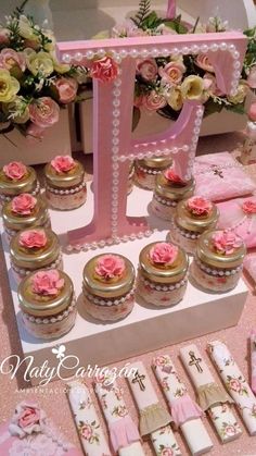 a table topped with lots of cupcakes and cookies