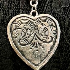 Melancholia Swirly & Silvery Large Distressed Heart Pendant On A Black Corded Necklace. The Cord Measures 17.5” In Length Plus A 2” Chain Extension Topped Off With A Crooked Heart Charm That Will Look Great Dangling Down The Back Of Your Neck. This Piece I Call Melancholia Because It Reminds Me Of A Sad Heart With A Brave Face. Vintage Pendant And Charm. Please Share If You’re Not Interested. Thanks. Bohemian Silver Heart Necklace, Silver Gothic Heart Charm Necklace, Heart-shaped Metal Necklaces For Festivals, Nickel Free Heart Shaped Jewelry For Festivals, Silver Gothic Necklace With Heart Charm, Silver Gothic Jewelry With Heart Charm, Nickel-free Heart-shaped Jewelry For Festival, Gothic Silver Necklace With Heart Charm, Gothic Silver Jewelry With Heart Charm