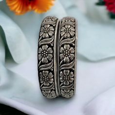 Oxidized lightweight silver bangle pair in floral pattern. Inspire your style with this beautiful Indian ethnic bohemian style tribal jewelry this festive season.  All orders Ship same day if placed before 4:00 PM EST  Create beautiful memory for any occasion with elegant jewelry for your loved ones We will be happy to navigate you through the process so if you have any questions regarding our product before placing an order reach out to us and we will be there to help you.  Thank you for your v Handmade Silver Bangle For Festivals, Silver Bangle With Tilla Detailing As A Gift, Bohemian Oxidized Wedding Bangle, Bohemian Sterling Silver Bracelets For Festive Occasions, Silver Bangle With Intricate Design, Handmade Antique Silver Bangle For Wedding, Silver Bohemian Jewelry With Meenakari, Silver Engraved Bangle For Festive Occasions, Bohemian Silver Jewelry With Meenakari