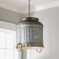 a light fixture hanging from a ceiling in a room