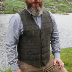 Its timeless quality makes this Irish tweed waistcoat well worth investing in if you have a penchant for classic Irish Design. Perfect for an all year round appeal. Full cloth back and front . Fully Lined. Lovely green Irish tartan with blue and red chech - very easy to match with other garments. Can be worn as formal or casual vest(ex with jeans) Featuring: -5 Button closing, -Darted front, -2 pockets(non functional). -Full tweed back. -Belted back. -Size chart on pic no. 10 Pictures taken at G Casual Tweed Vest For Winter, Wool Vest Outfit, Peaky Blinders Style, Waistcoat Outfit, Mens Formal Vest, Irish Tartan, Irish Tweed, Irish Fashion, Men's Denim Style