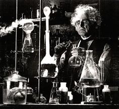 an old man is working in a lab with many flasks and beakles