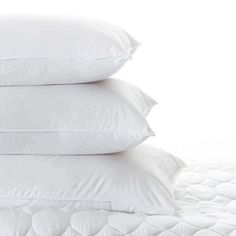 three pillows stacked on top of each other