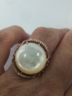 Luxury Mother Of Pearl Rings For Wedding, Luxury Mother Of Pearl Wedding Ring, Elegant Mother Of Pearl Round Rings, White Mother Of Pearl Round Pearl Ring, Classic Mother Of Pearl Round Rings, Classic Mother Of Pearl Rings, Formal Mother Of Pearl Round Ring, Elegant Round Mother Of Pearl Ring, Wedding Pearl Ring In Mother Of Pearl