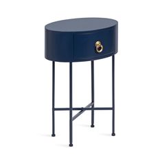 a blue side table with two brass handles on the bottom and one drawer at the top