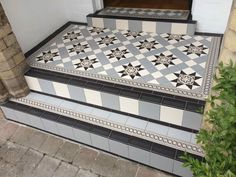 the steps are decorated with black and white tiles