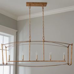 a chandelier with candles hanging from it