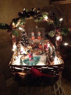 a christmas display in a basket with lights