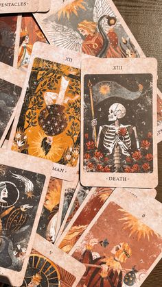 several tarot cards with images of skeletons and angels on them, all in different colors