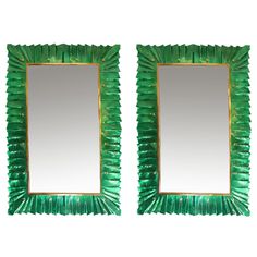 a pair of green mirrors sitting next to each other