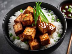 tofu and rice in a bowl with chopsticks