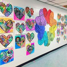 a wall with many different colored hearts on it