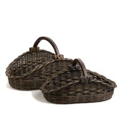 two wicker baskets sitting on top of each other