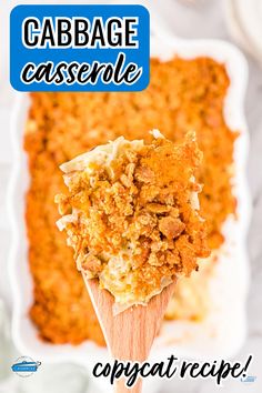 a scoop of cabbage casserole on a wooden spoon in front of a white plate