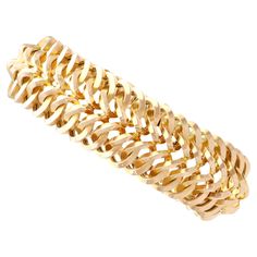 An exceptional, fine and impressive vintage French 18 karat yellow gold bracelet; part of our diverse vintage French jewellery collections. This exceptional, fine and impressive vintage gold bracelet has been crafted in 18k yellow gold. The substantial multi-dimensional articulated bracelet consists of interlacing curvilinear links, conjoined within a repeating chevron pattern; this well-made design has been crafted in a pleasing tactile manner. This 1960s gold bracelet secures to the reverse wi Luxury Antique Yellow Gold Chain Bracelet, Vintage Gold Bracelet, Vintage Gold Earrings, French Jewelry, Antique Coins, Gold Armband, Eagle Head, Yellow Gold Bracelet, Coin Pendant