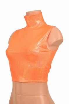 "This item is made to order, please read all the way through the listing before purchasing! This sizzling hot orange sparkly jewel holographic top has an amazing shine! It features an adorable turtle neck neckline in front with a sleeveless design. It is made of four way stretch lycra spandex, and it fits like a glove! Super figure flaunting and fun! LENGTH: 8\" (from the underarm to the hemline) Womens Sizing (See below for instructions on where measurements should be taken) XXS: Bust 29\"-30\" Fitted Sleeveless Shiny Top, Trendy Fitted Shiny Tops, Fitted Shiny Top For Spring, Fitted Summer Tops With Shine, Fitted Tops With Shine For Spring, Orange Stretch Tank Top For Party, Stretch Orange Tank Top For Party, Orange Fitted Top For Party, Orange Sleeveless Top For Night Out