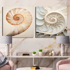 three paintings on the wall in a living room