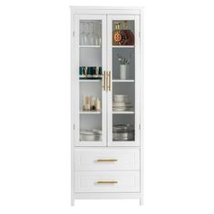 a tall white cabinet with glass doors and gold handles on the bottom shelf is shown