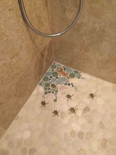 a tiled shower stall with an animal on the floor and bubbles in the bathtub