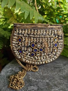 Small evening clutch handbag. Stylish, Vintage/boho style small purse for evening out. Brass and stone decorations. Handmade in India. Fits card case, lipstick, money. Length 13cm High 10cm Depth 3cm String 110cm You may find more stone and brass handbags in my Etsy shop: EthnicShopCy For any extra details please send me a message and I will answer at my earliest. Color may look slightly different due to your device brightness or resolution or other matters. Gold Bag With Mirror Work For Gift, Gold Bags With Mirror Work For Gifts, Bohemian Beaded Clutch For Festivals, Bohemian Clutch With Handwork As A Gift, Bohemian Beaded Potli Bag For Gifts, Bohemian Beaded Potli Bag As Gift, Handmade Pouch Evening Bag For Festivals, Bohemian Embellished Potli Bag As Gift, Bohemian Beaded Rectangular Evening Bag