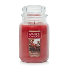 yankee candle with red wax and cinnamon