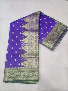 Hand Woven Banarsi Satin Silk Heavy Zari Pallu Bridal Silk Saree With Blouse OFFER- EXTRA 20$ OFF ON PURCHASE OF TWO PRODUCTS. A beautiful, delightful, and absolutely luxurious Banarasi dream! For Instance, The Saree Has where each thread of the Butiy Is knitted by hands. Additionally, It comes In the purest banarasi silk with the pure banarasi silk blouse piece. above all, with vows to sustainable fashion, this silk handloom product from Banaras is a masterpiece involving of brilliance & sheer endeavor of our creative artisans. Tassels vary from the image. Blouse worn by model is for styling purpose only. FABRIC - Banarasi Satin Silk BLOUSE PIECE - Yes TECHNIQUE - This Splendid Masterpiece is made of the finest Fekwa technique of Banaras. WEAVE - Handwoven SILK - 100% Authentic Banarasi S Puja Brocade Saree With Pallu, Brocade Saree With Pallu For Puja, Purple Dola Silk Traditional Wear With Meenakari, Purple Meenakari Dola Silk Traditional Wear, Paithani Silk Choli For Puja, Ceremonial Katan Silk Traditional Wear With Zari Weaving, Purple Traditional Wear With Pallu For Diwali, Ceremonial Dola Silk Traditional Wear With Cutdana, Purple Banarasi Silk Traditional Wear With Pallu