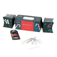 Bohin has created a "Christmas Cracker" for quilters and Sewists. Inside this delightful holiday gift box is a pack of Couturex extra fine straight pins, plus an assortment pack of hand sewing needles. Glass Head, Needle Pouch, Christmas Cracker, Hand Sewing Needles, Quilting Notions, Holiday Gift Box, Straight Pins, Christmas Crackers, Sewing Needles