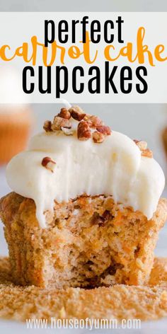 a cupcake with white frosting and pecans on top is cut in half