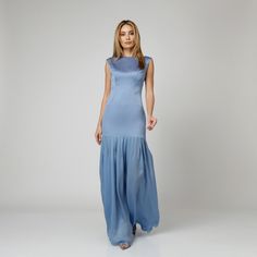 Celebrate Femininity with our Skye Pleated Silk Dress, embracing your silhouette with exquisite finesse. Expertly crafted from blue double silk satin, it features a fitted long bodice, gracefully tracing the curves of the body.  As the eye travels downward, it finishes into a semi-sheer silk charmeuse pleated skirt, adding to the feminine charm of this long dress. Features concealed zipper back fastening, ensuring a seamless finish.  Complete the sophisticated ensemble with a pair of high-heeled Blue Satin Finish Evening Dress For Formal Occasions, Elegant Blue Gown With Satin Finish, Formal Blue Evening Dress With Satin Finish, Formal Blue Satin Finish Evening Dress, Formal Blue Satin Evening Dress, Blue Satin Floor-length Evening Dress, Floor-length Blue Gown With Satin Finish, Elegant Blue Bias Cut Maxi Dress For Gala, Blue Satin Finish Floor-length Gown