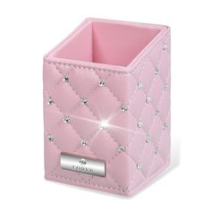 a small pink box with diamonds on the front and bottom, sitting on a white surface