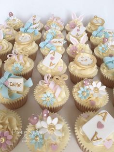 there are many cupcakes that have been decorated with bows and numbers on them