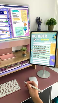 a person using a computer on a desk with a mouse and keyboard in front of the monitor