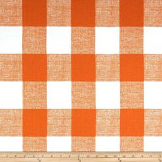 an orange and white checkered table cloth