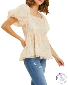 Indulge in romance with our floral puff-sleeved blouse. The square neck and smocked back add a flirty touch to this babydoll top. Perfect for date night or a day out with friends, it's the ideal combination of sweet and stylish. Material: 100% Polyester