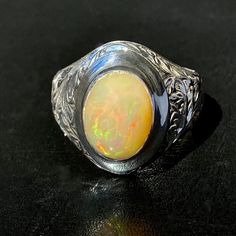 925 STERLING SILVER MEN'S RING WITH NATURAL OPAL Quality meets perfection Handcrafted by Turkish artisan jewelers Unique collectors item METAL : .925 Sterling Silver GEMSTONE: Opal (origin: Africa) DIMENSIONS OF STONES: 10x14 mm SIZE: US 10 Classic Opal Jewelry With Polished Finish, Opal Rings With Polished Finish For Formal Occasions, Formal Opal Rings With Polished Finish, Untreated White Gold Jewelry For Formal Occasions, Classic Untreated White Gold Rings, Classic Untreated Sterling Silver Rings, Antique Oval Sterling Silver Signet Ring, Spiritual Hallmarked Signet Ring For Formal Occasions, Spiritual White Gold Rings For Formal Occasions