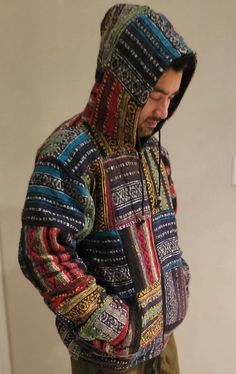 "Namaste Aztec Styled Unisex Organic Fleece lined Winter Handmade Comfortable Warm Jacket. This Woolen jacket is fleece lined which is black in color, zips up and has two side pockets. This hooded jacket is knitted to form different Aztec styled in different colors. No harmful chemicals has been used and it is handmade in Nepal. As it is handmade, there might be slight variation in design and color. No child labor practiced, fairly traded. Manufactured In: Nepal Design : Variation ￼Chest measure Long Sleeve Hooded Jacket With Patchwork For Cold Weather, Long Sleeve Patchwork Hooded Jacket For Cold Weather, Multicolor Long Sleeve Fleece Jacket For Winter, Multicolor Hooded Fleece Jacket For Winter, Multicolor Fleece Hoodie Outerwear, Multicolor Hooded Fleece Jacket, Multicolor Hooded Outerwear With Fleece Lining, Hooded Multicolor Outerwear With Fleece Lining, Hooded Patchwork Fleece Jacket